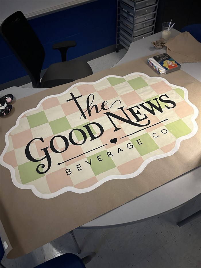 The Good News Beverage Co. hand-painted banner