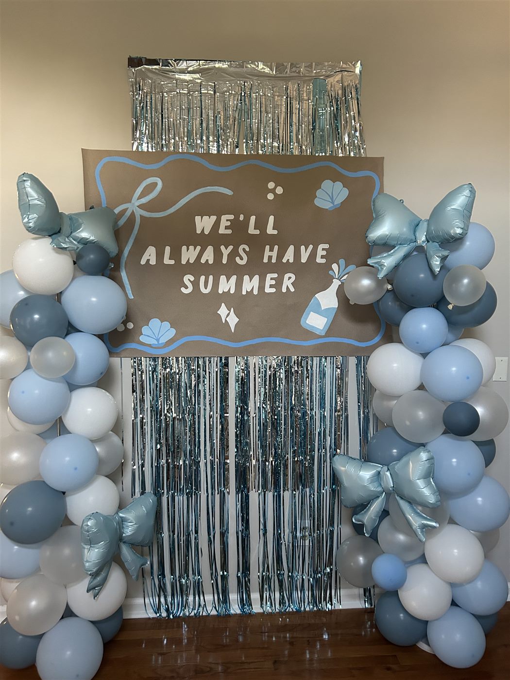 'We'll always have summer' painted party backdrop with balloons
